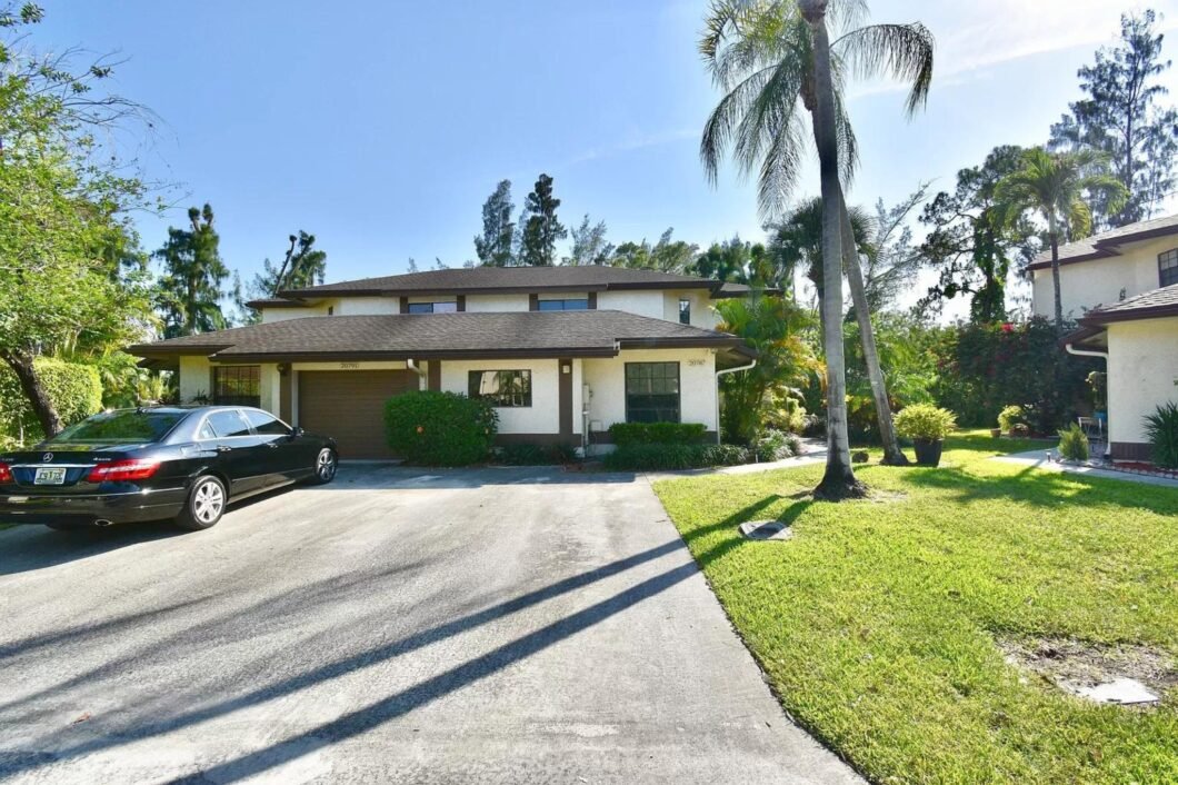 Experience luxury living at 20787 Boca Ridge Dr N, a stunning home in Boca Raton's prestigious Boca Ridge community. Discover elegance and comfort.